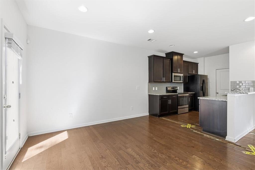 5064 Longview Walk Decatur, GA 30035 - Photo 14 of 30 a view of kitchen with stainless steel appliances cabinets and wooden floor