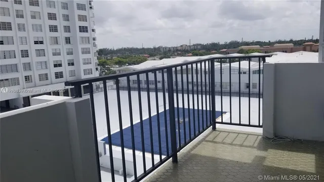 a view of a balcony with wooden floor