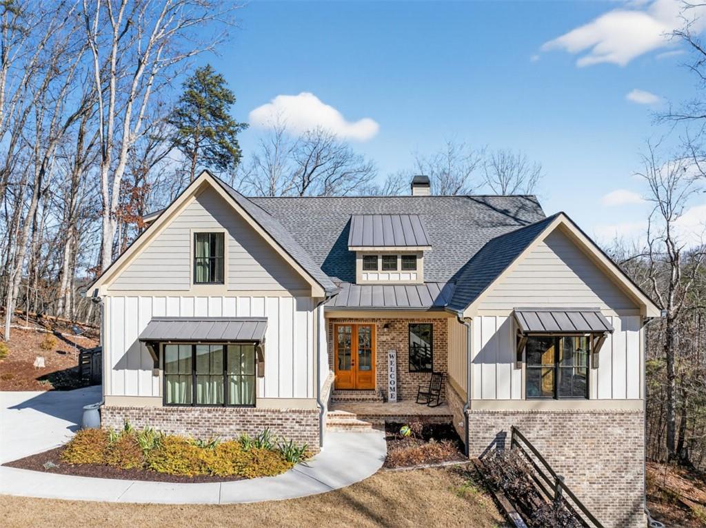 a front view of a house with garden