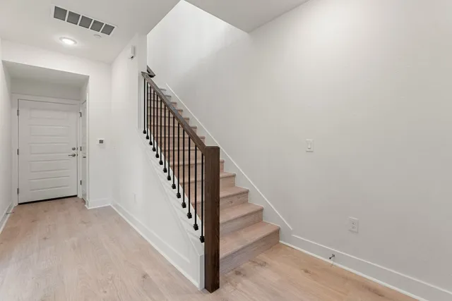 a view of a hallway with staircase