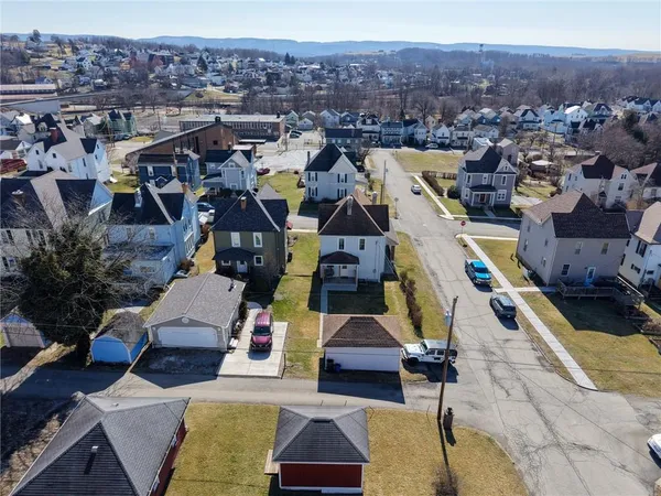 an aerial view of residential houses with outdoor space
