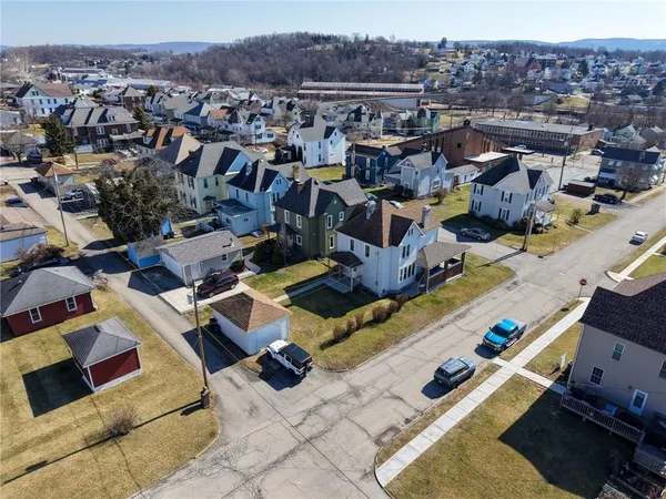 an aerial view of residential houses with outdoor space
