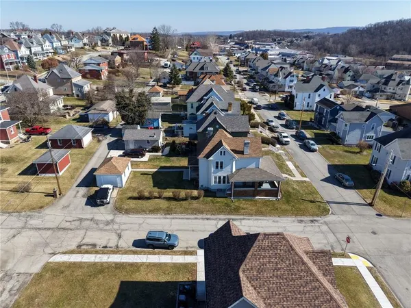 a view of multiple houses with a swimming pool