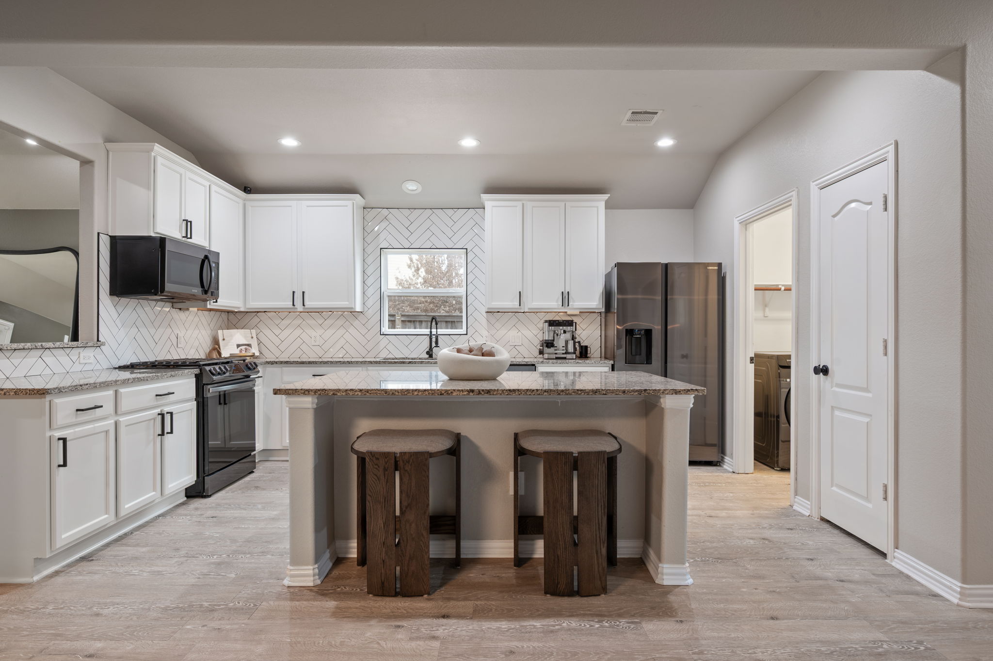 3724 Brean Down Road Pflugerville, TX 78660 - Photo 1 of 34 a kitchen with stainless steel appliances granite countertop a refrigerator and a stove top oven