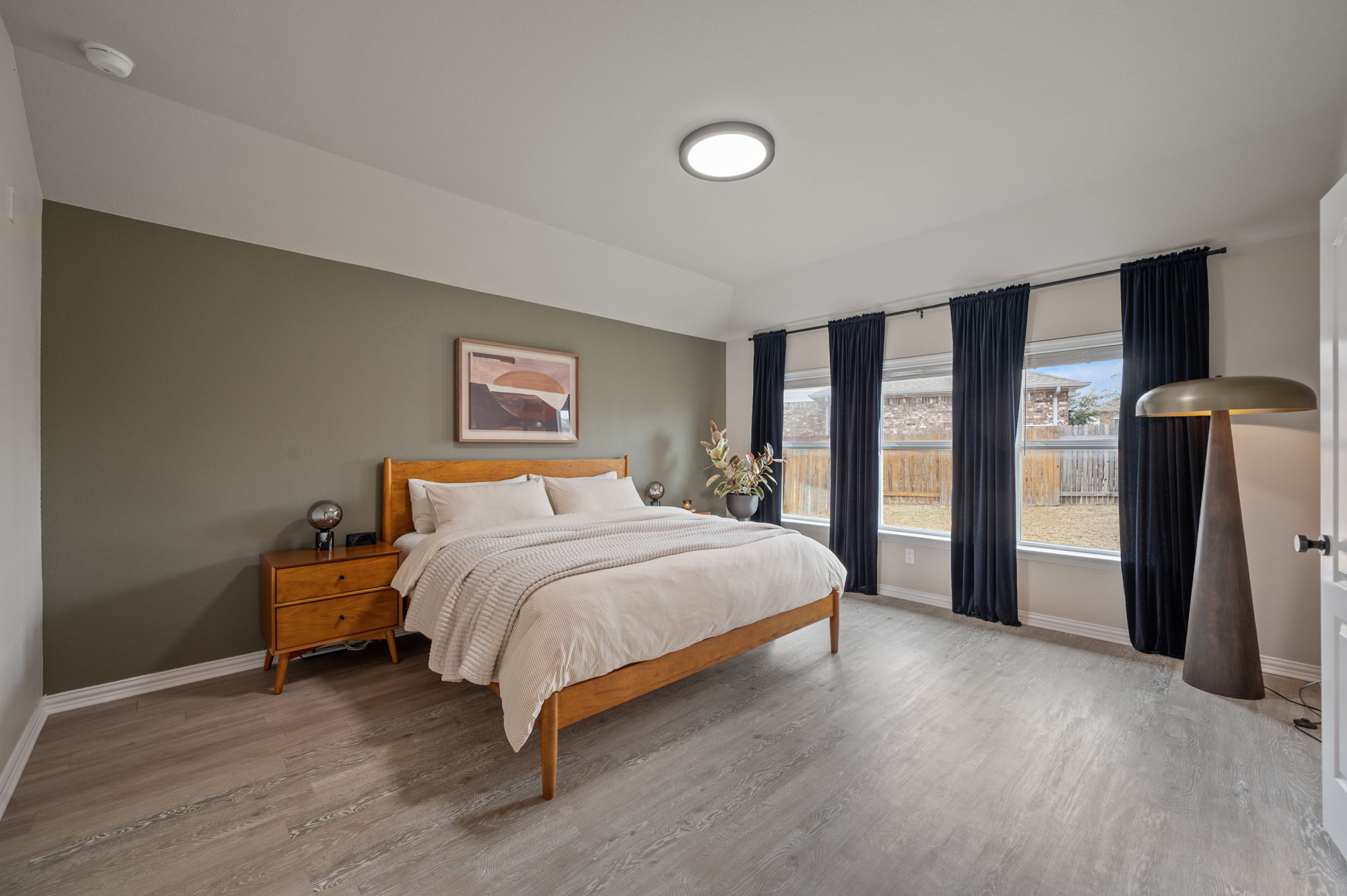 3724 Brean Down Road Pflugerville, TX 78660 - Photo 12 of 34 a bedroom with a bed and a large window