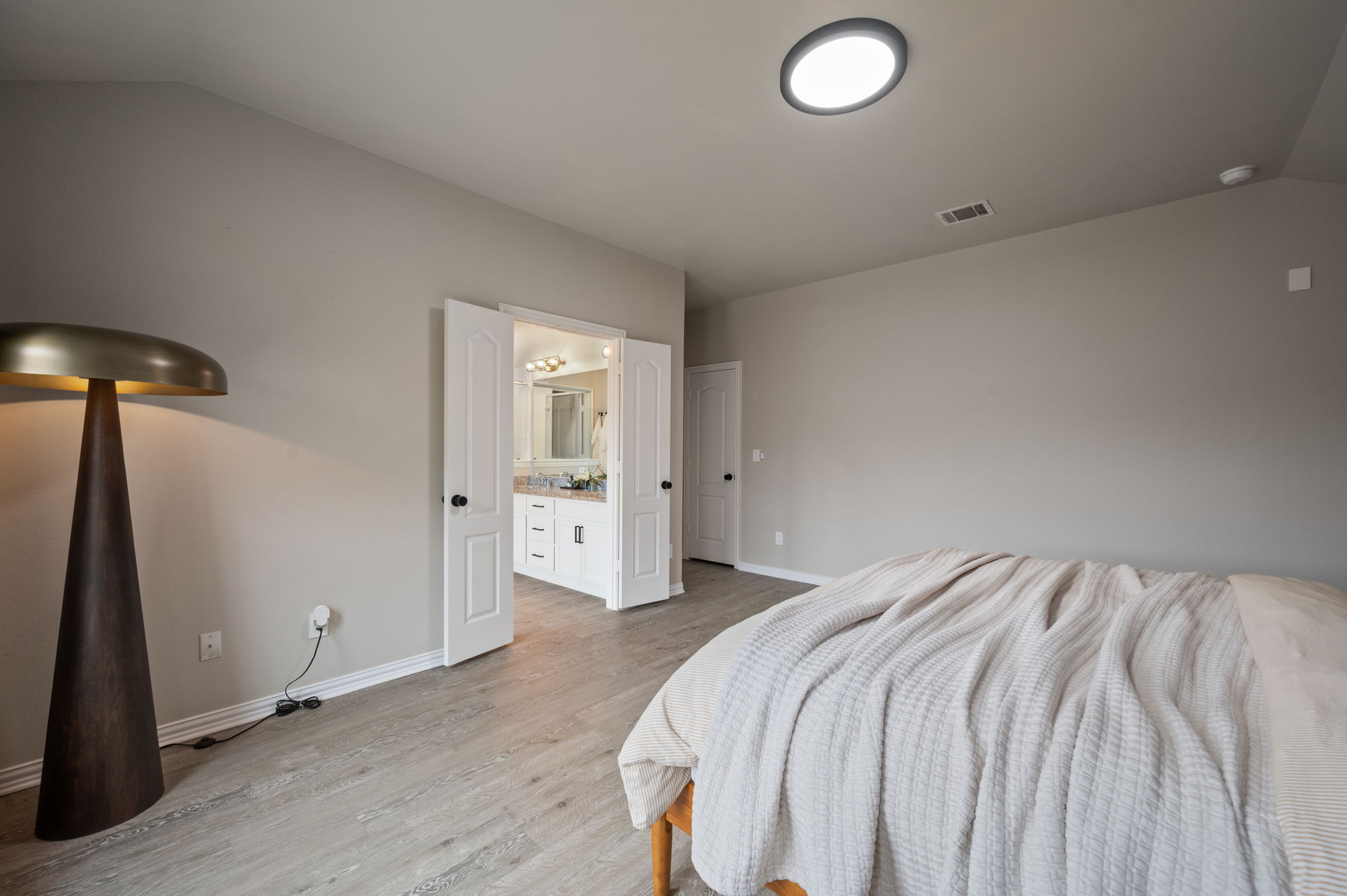 3724 Brean Down Road Pflugerville, TX 78660 - Photo 13 of 34 a bedroom with a bed and a lamp on the table