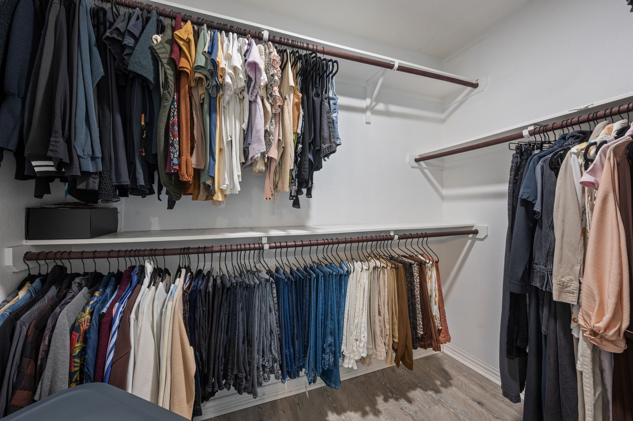 3724 Brean Down Road Pflugerville, TX 78660 - Photo 16 of 34 a view of walk in closet with clothes and shoes