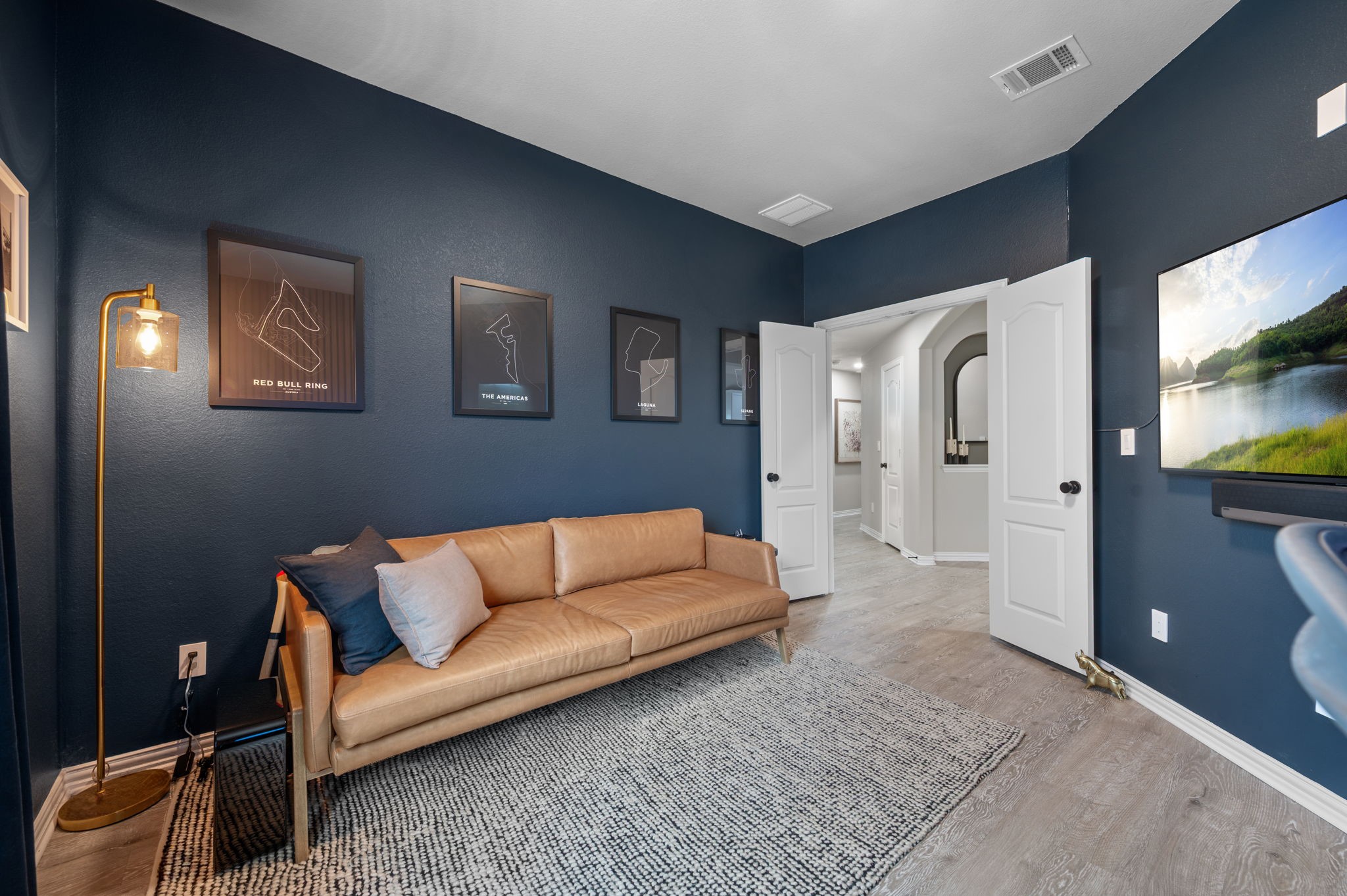 3724 Brean Down Road Pflugerville, TX 78660 - Photo 20 of 34 a living room with furniture and a flat screen tv