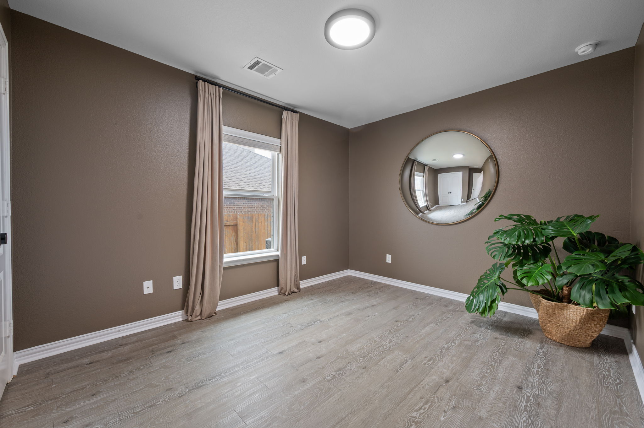 3724 Brean Down Road Pflugerville, TX 78660 - Photo 22 of 34 an empty room with mirror and wooden floor