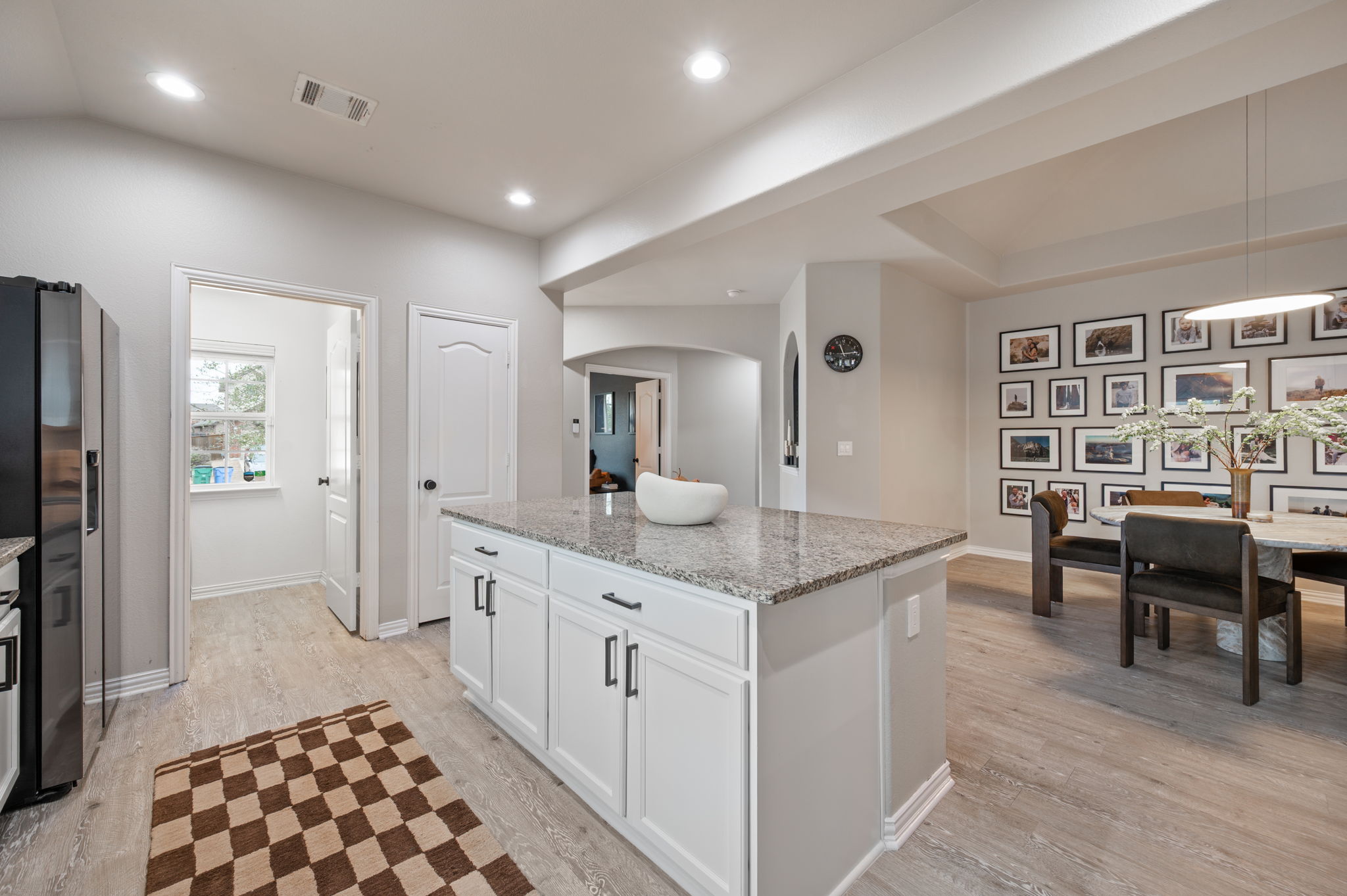 3724 Brean Down Road Pflugerville, TX 78660 - Photo 5 of 34 a spacious bathroom with a granite countertop sink and a mirror