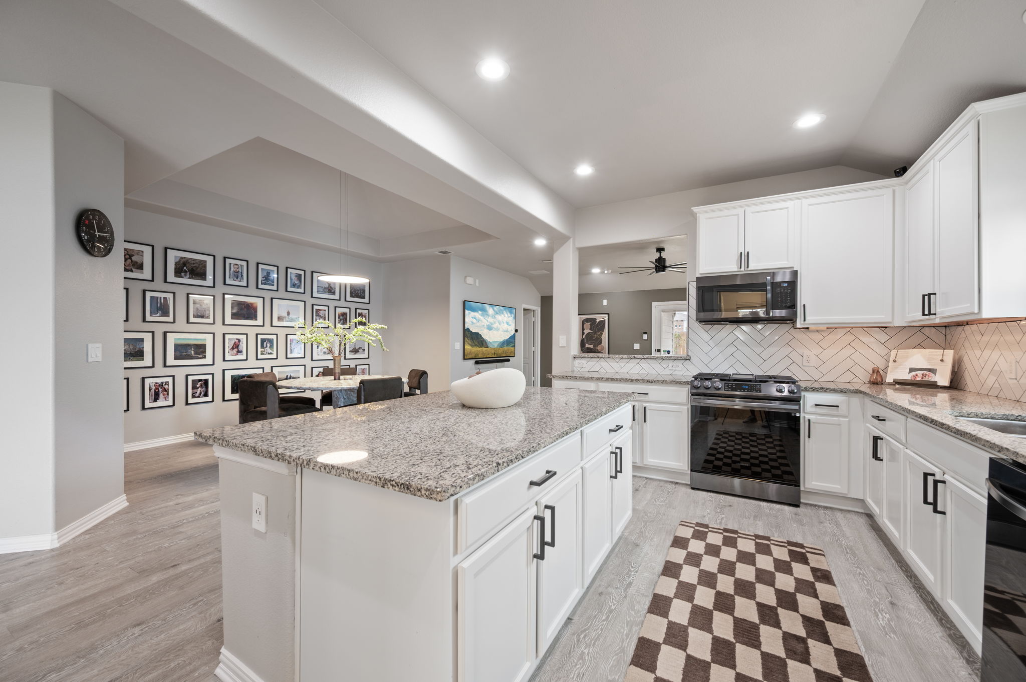 3724 Brean Down Road Pflugerville, TX 78660 - Photo 6 of 34 a kitchen with stainless steel appliances granite countertop a sink stove and cabinets