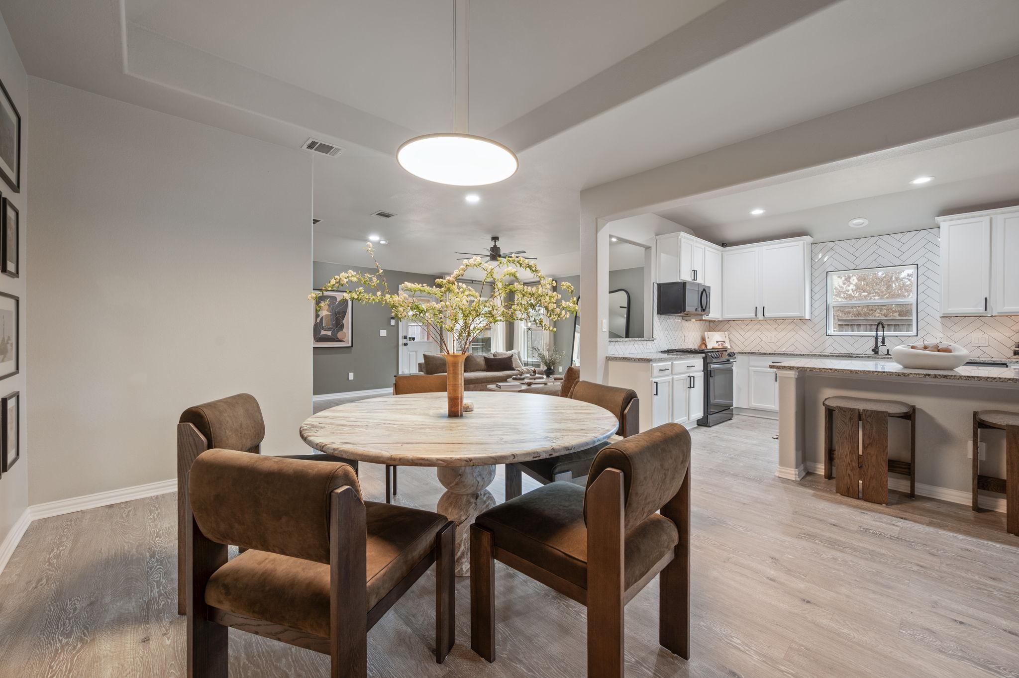 3724 Brean Down Road Pflugerville, TX 78660 - Photo 8 of 34 a view of a dining room with furniture and wooden floor