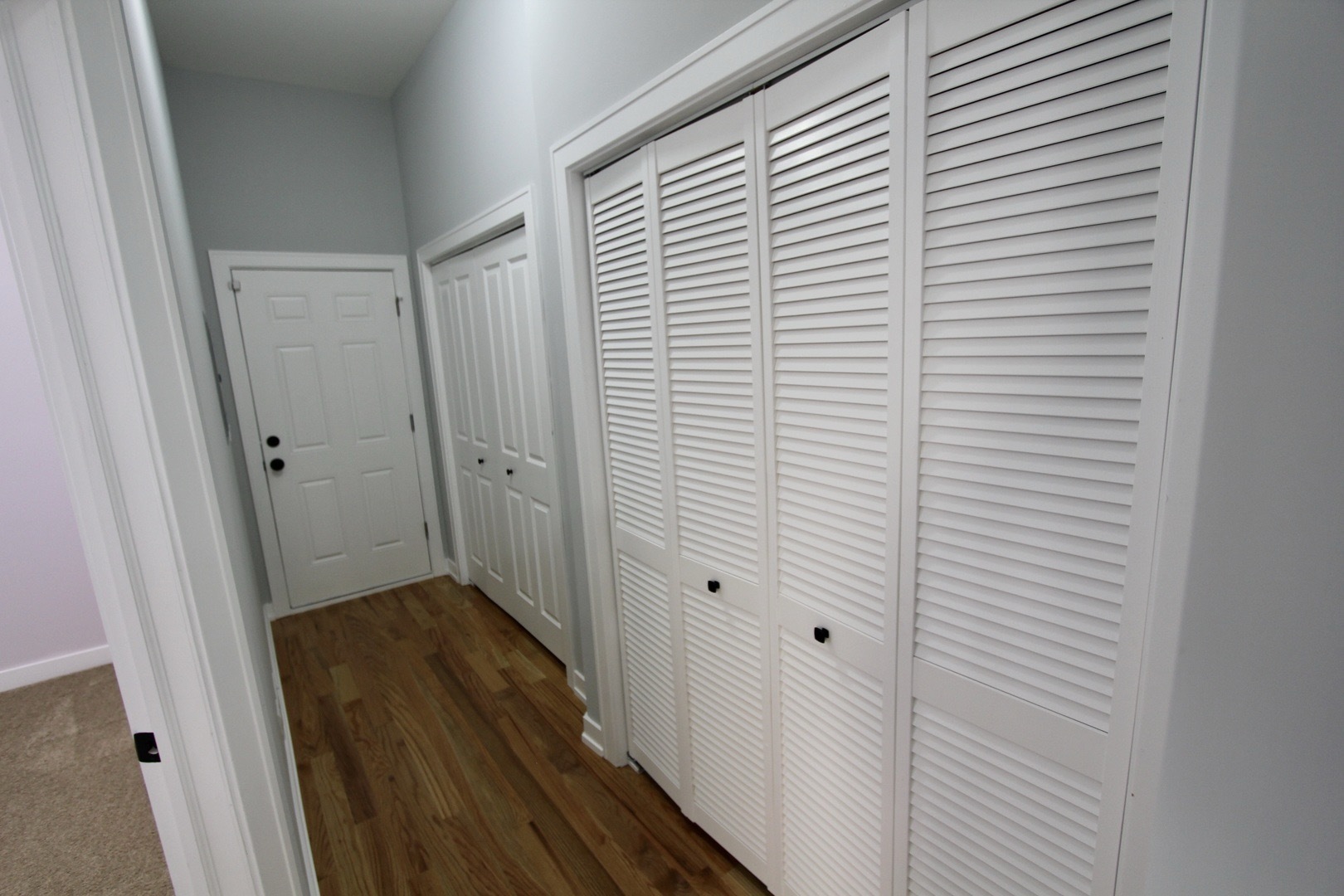 7413 South Princeton Avenue, Unit 1 Chicago, IL 60621 - Photo 15 of 24 a view of a hallway with wooden floor