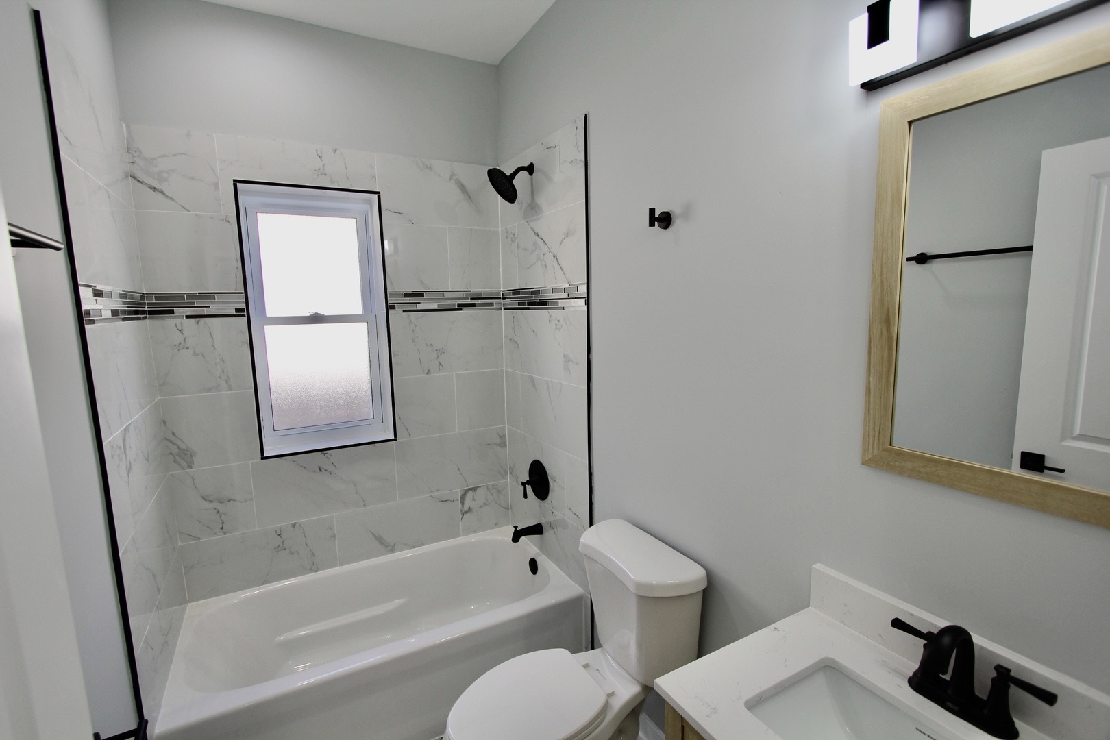 7413 South Princeton Avenue, Unit 1 Chicago, IL 60621 - Photo 18 of 24 a bathroom with a toilet and a bathtub
