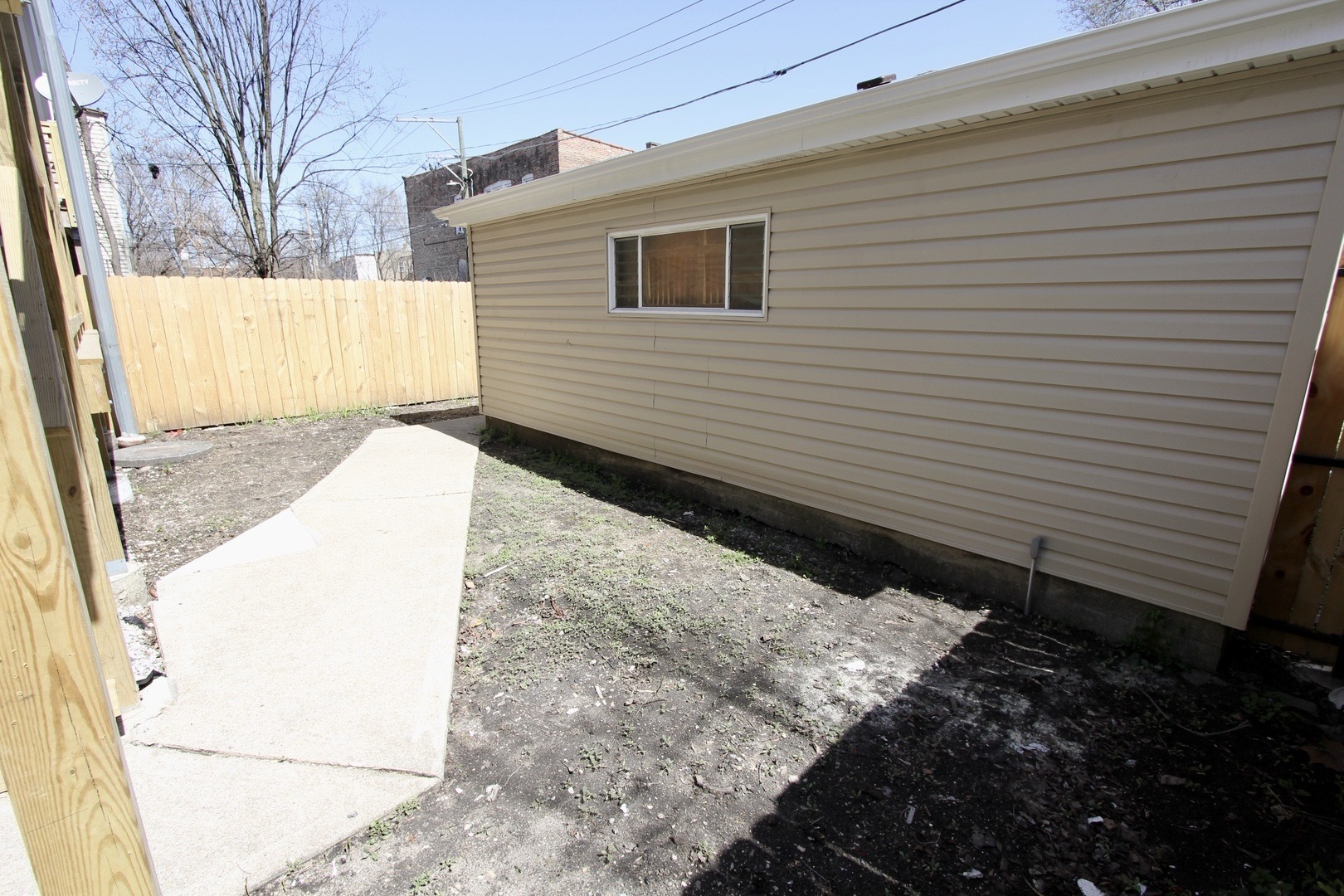 7413 South Princeton Avenue, Unit 1 Chicago, IL 60621 - Photo 20 of 24 a view of a back yard of the house