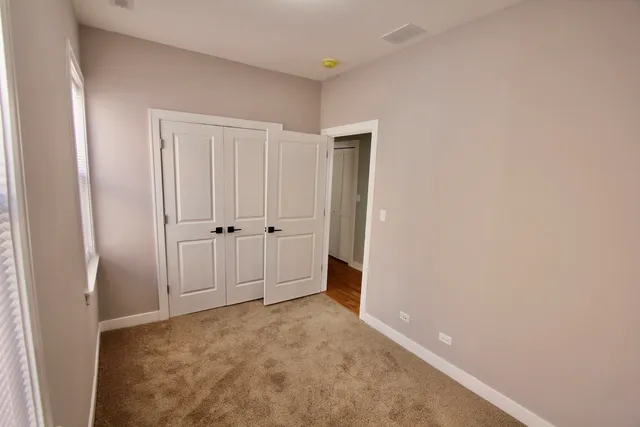 a kitchen with a sink appliances and cabinets