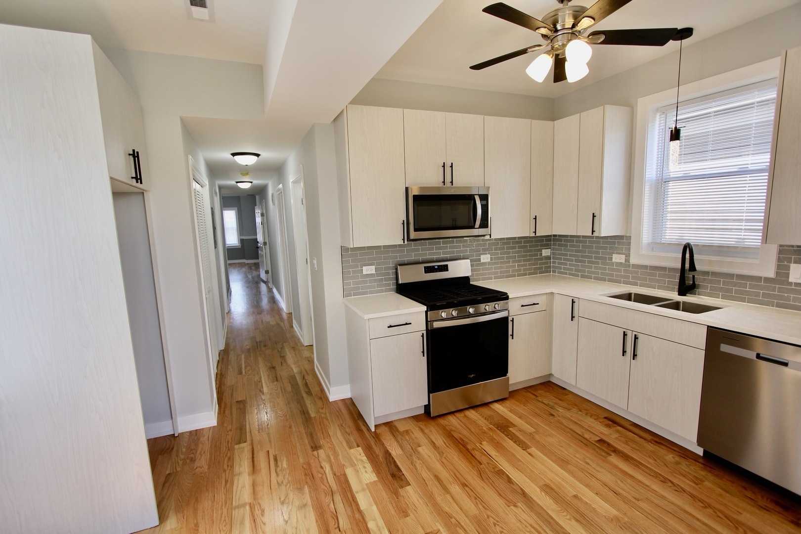 7413 South Princeton Avenue, Unit 1 Chicago, IL 60621 - Photo 24 of 24 a kitchen with a sink appliances and cabinets