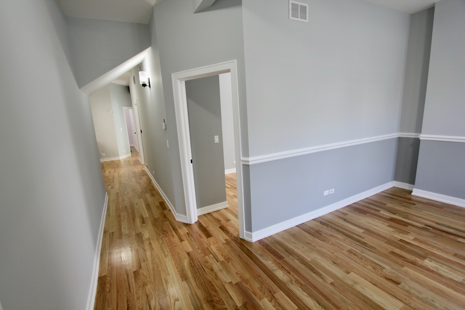 7413 South Princeton Avenue, Unit 1 Chicago, IL 60621 - Photo 3 of 24 a view of a room with wooden floor
