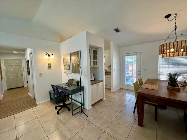 a workspace with furniture and window