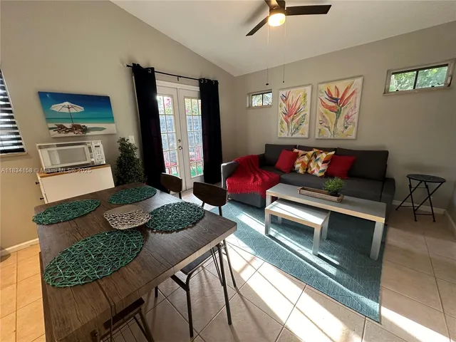 a living room with furniture and a rug