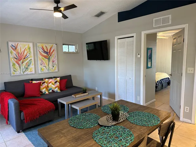 a living room with furniture and a rug