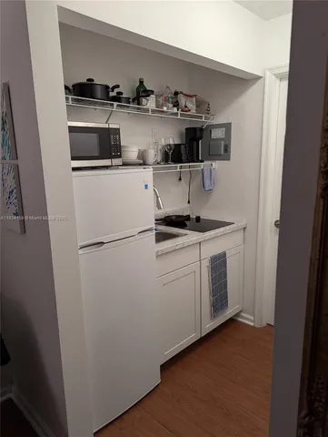 a kitchen with stainless steel appliances a sink and cabinets