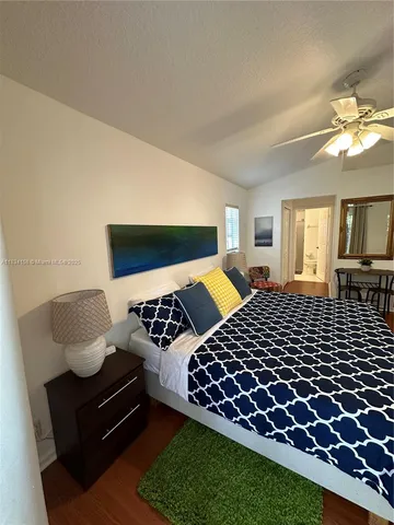 a bedroom with furniture and a lamp