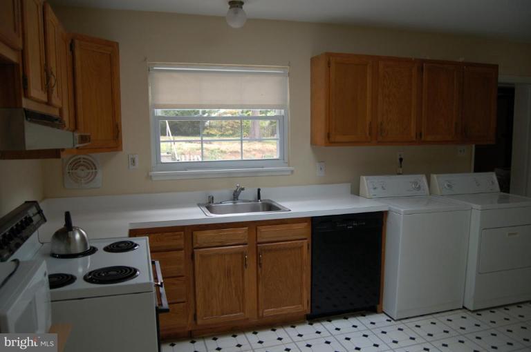 2016 Derrickson Road Windsor Mill, MD 21244 - Photo 3 of 11 a kitchen with sink cabinets and appliances