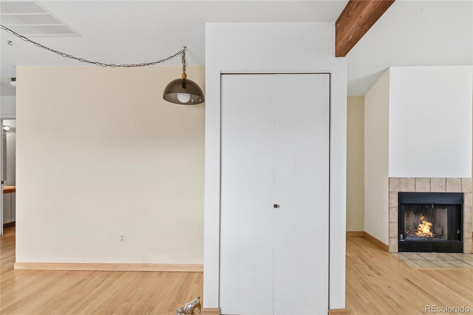 5510 Stonewall Place, Unit 24 Boulder, CO 80303 - Photo 11 of 30 a view of a room with wooden floor and a fireplace