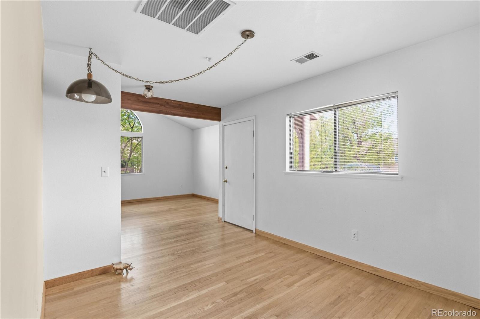 5510 Stonewall Place, Unit 24 Boulder, CO 80303 - Photo 12 of 30 a view of empty room with wooden floor and fan