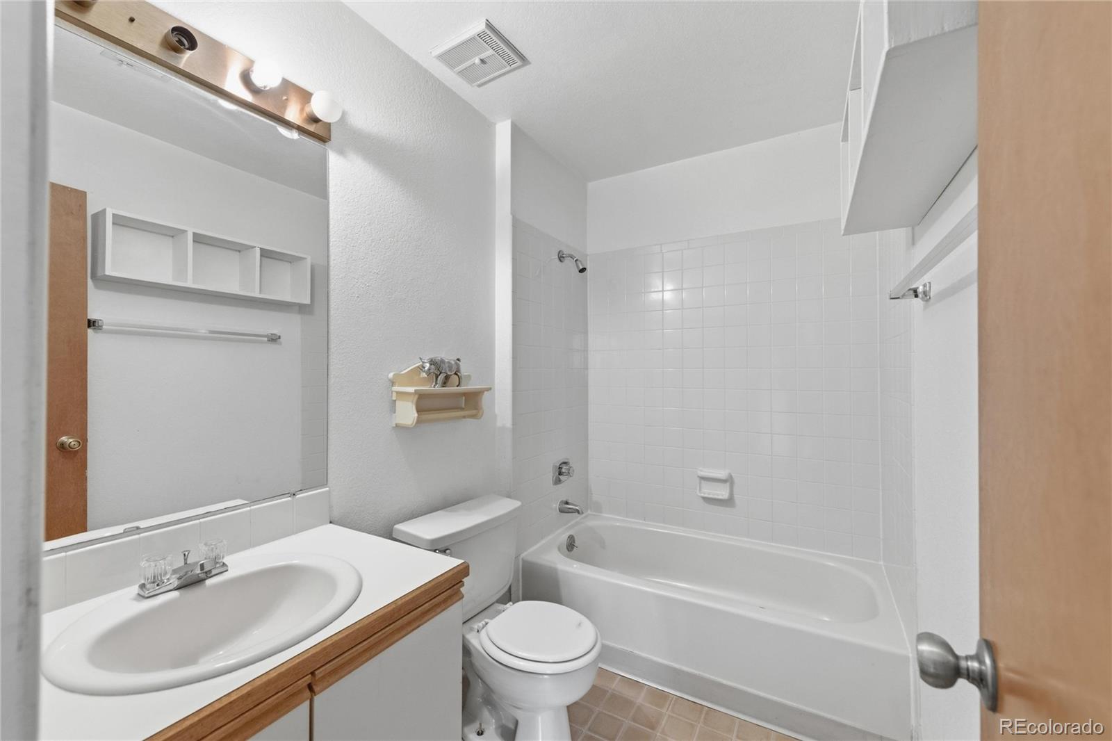 5510 Stonewall Place, Unit 24 Boulder, CO 80303 - Photo 20 of 30 a bathroom with a sink toilet vanity and shower