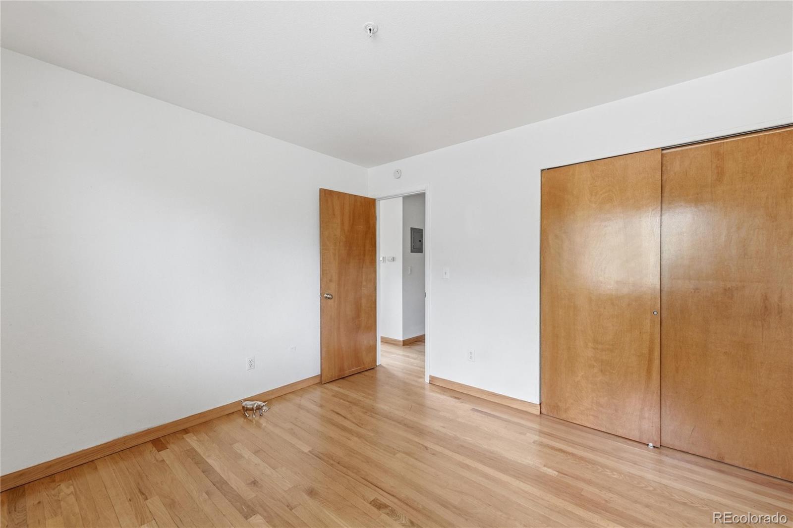 5510 Stonewall Place, Unit 24 Boulder, CO 80303 - Photo 25 of 30 a view of an empty room with wooden floor and closet