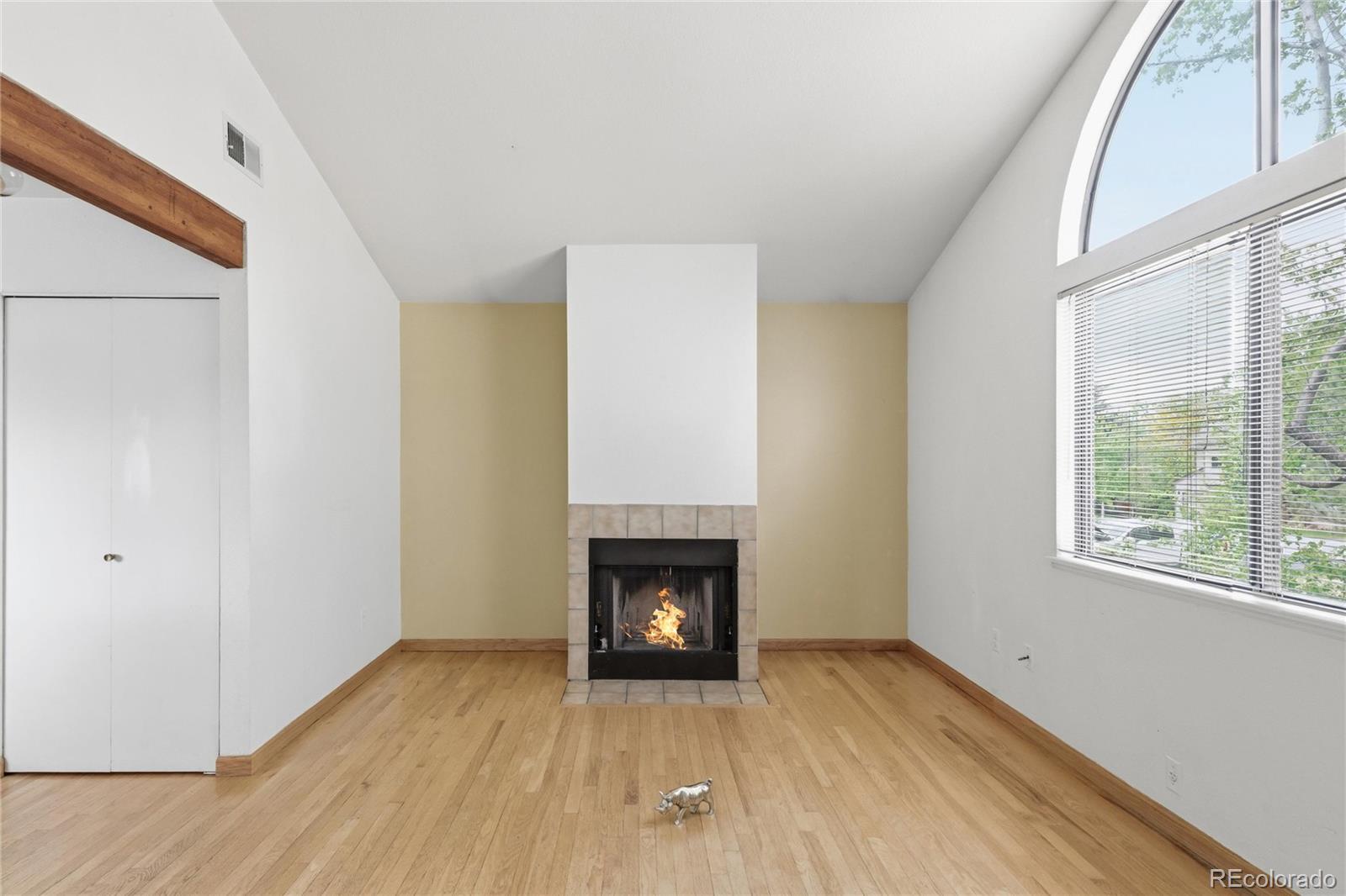 5510 Stonewall Place, Unit 24 Boulder, CO 80303 - Photo 7 of 30 a view of an empty room with wooden floor and a window