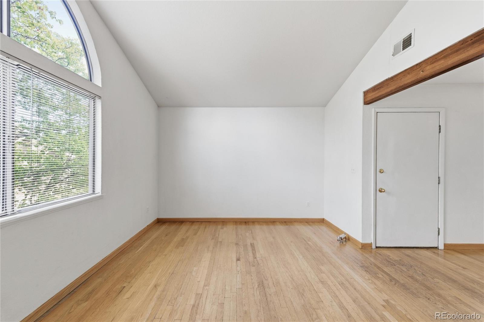 5510 Stonewall Place, Unit 24 Boulder, CO 80303 - Photo 9 of 30 a view of empty room with wooden floor and fan