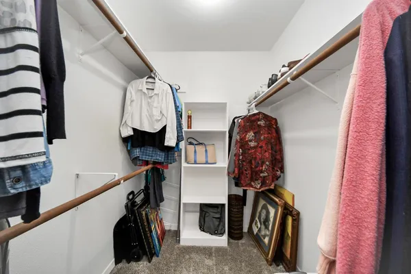 a view of a livingroom with furniture and closet