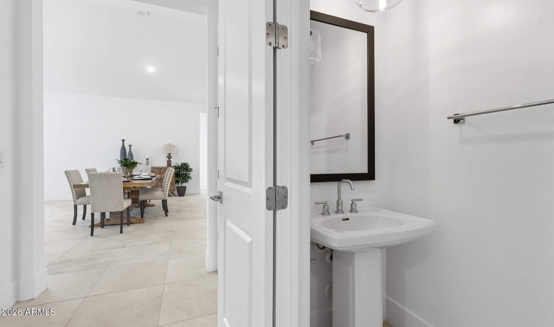 663 East Grayling Road San Tan Valley, AZ 85140 - Photo 12 of 31 a bathroom with a sink and a mirror