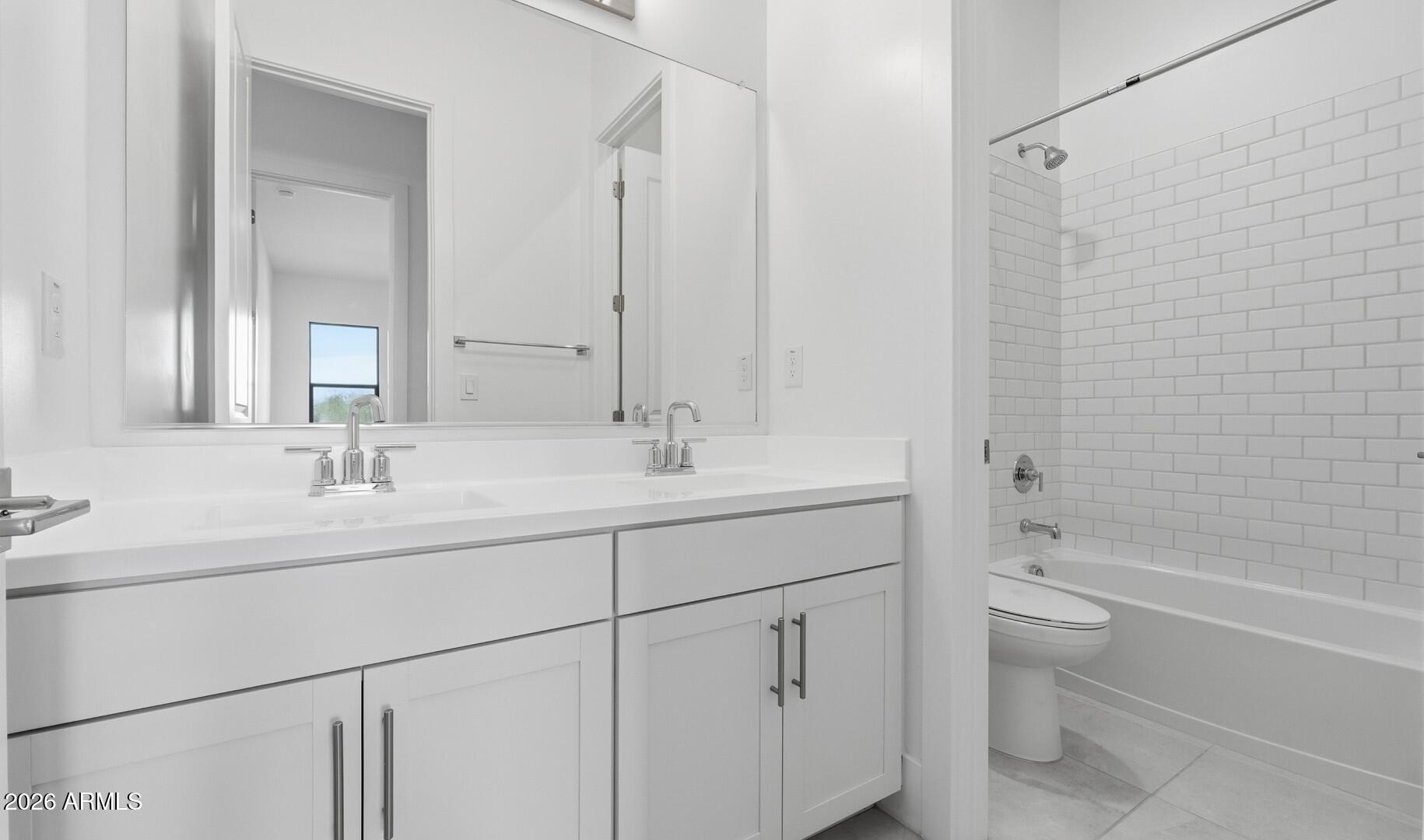663 East Grayling Road San Tan Valley, AZ 85140 - Photo 15 of 31 a bathroom with a double vanity sink toilet mirror and shower