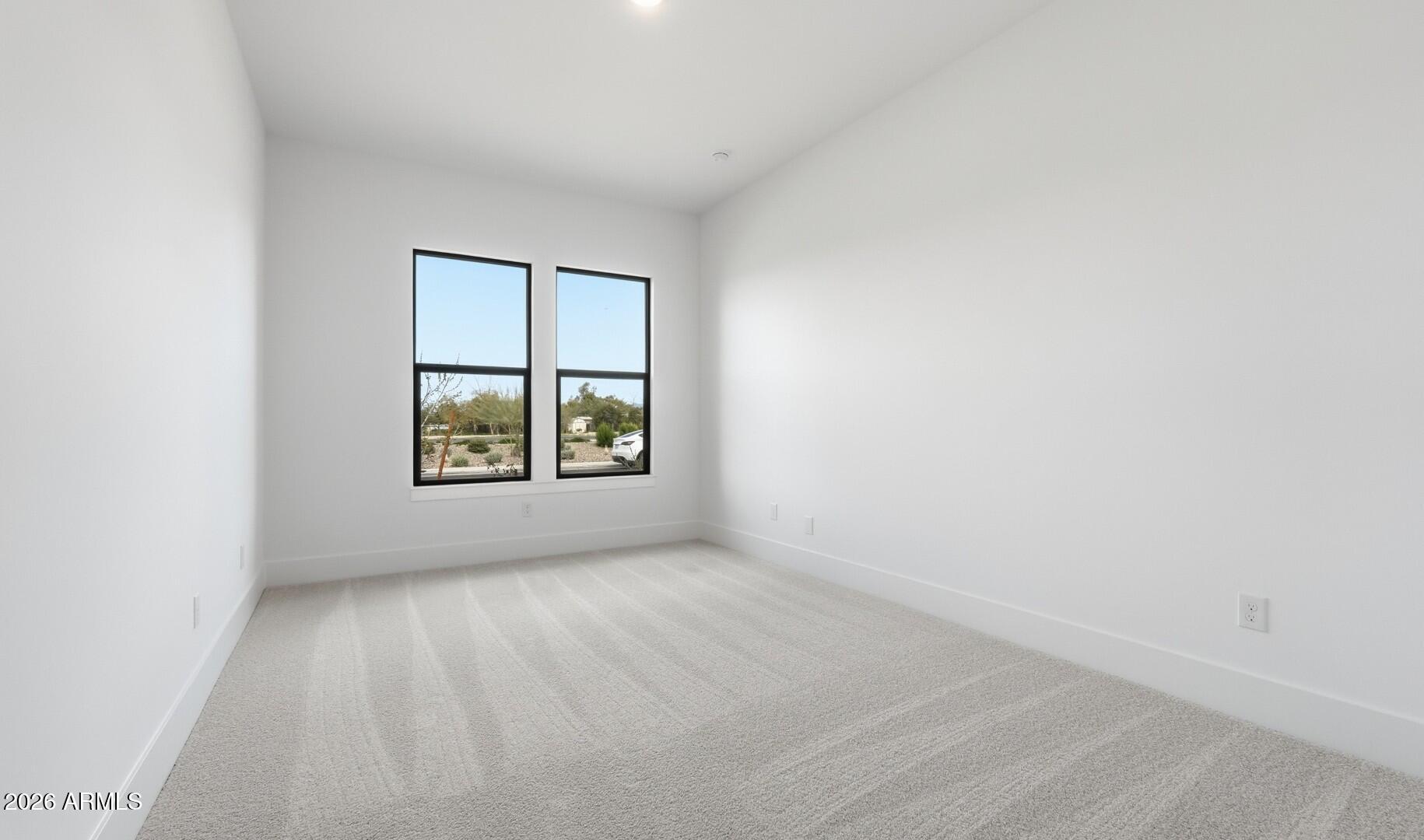 663 East Grayling Road San Tan Valley, AZ 85140 - Photo 16 of 31 an empty room with windows