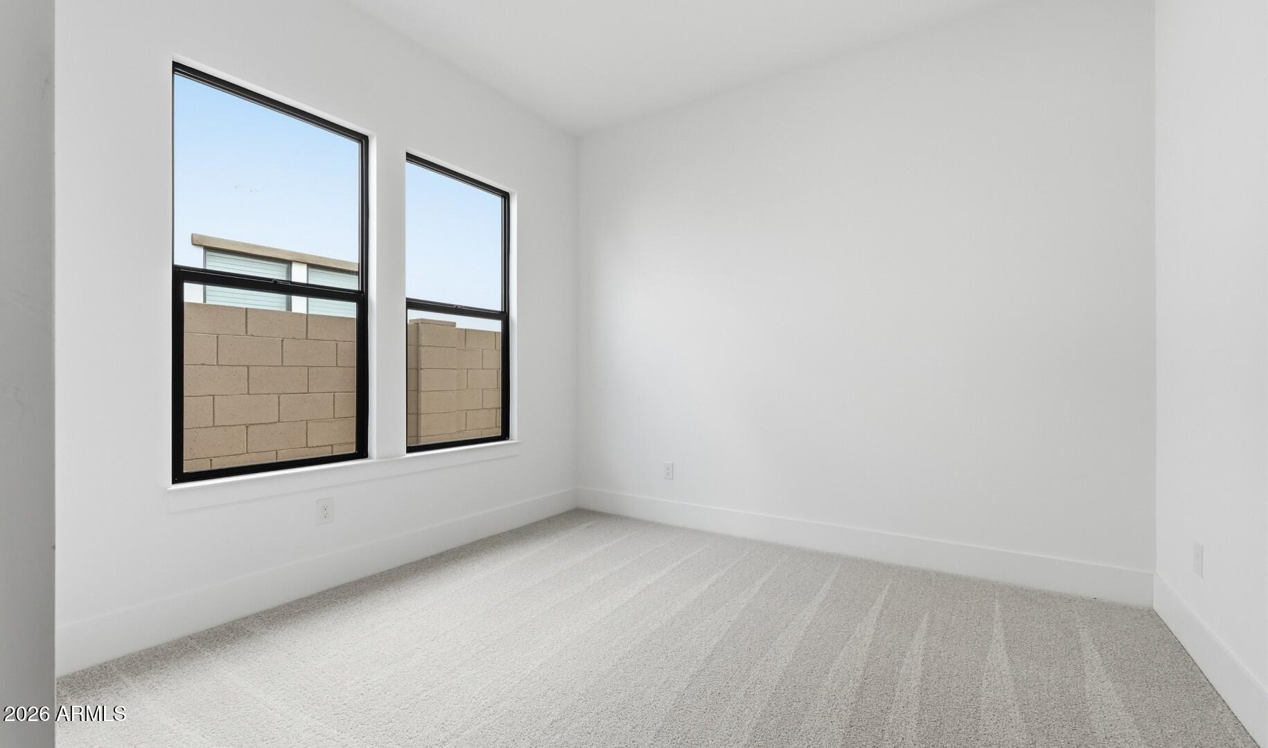 663 East Grayling Road San Tan Valley, AZ 85140 - Photo 20 of 31 an empty room with windows and closet