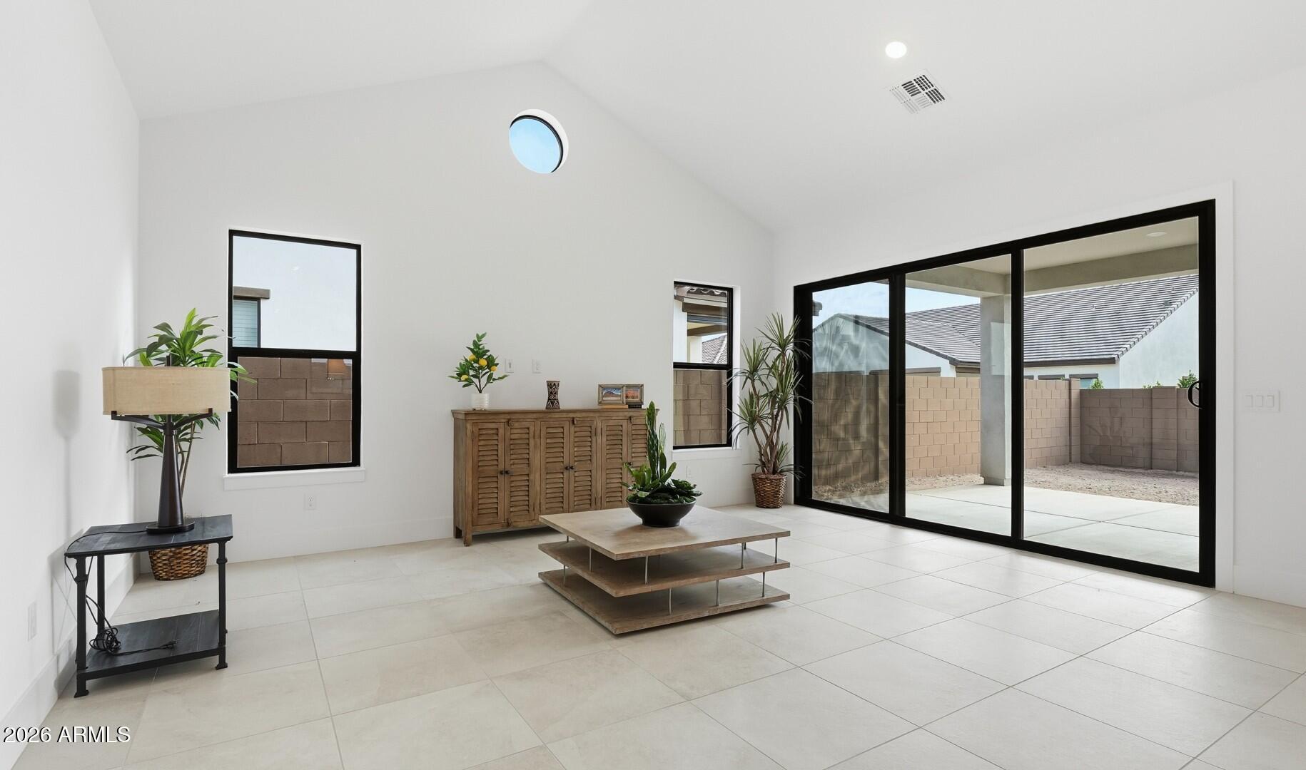 663 East Grayling Road San Tan Valley, AZ 85140 - Photo 7 of 31 a living room with furniture and large windows