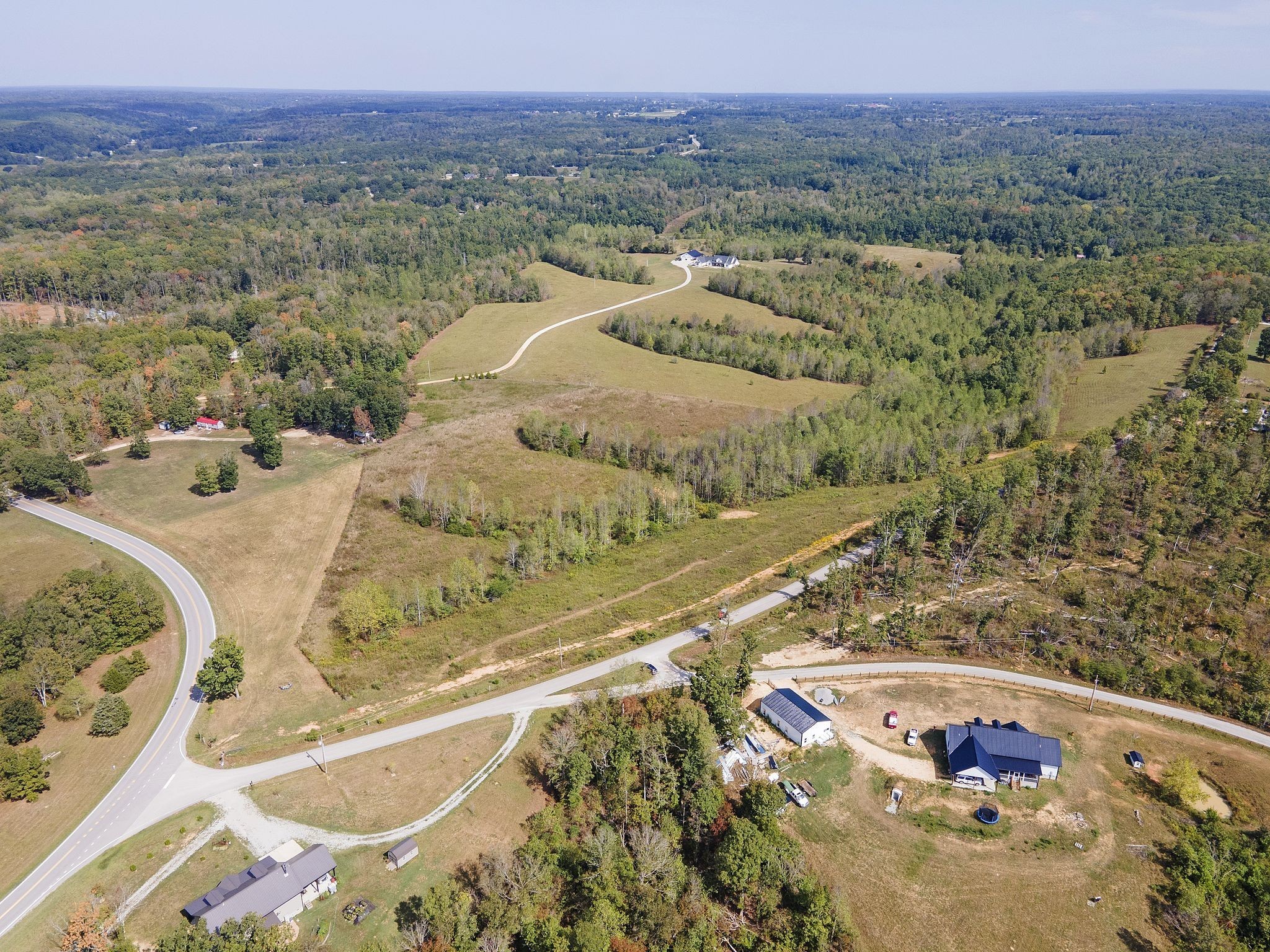 2047 Buffalo Road Hohenwald, TN 38462 - Photo 23 of 25 a view of a lake with a mountain