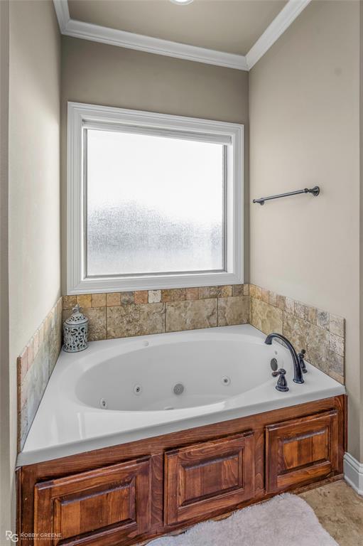 3034 Sagefield Lane Haughton, LA 71037 - Photo 16 of 28 a bathroom with a bathtub and a shower