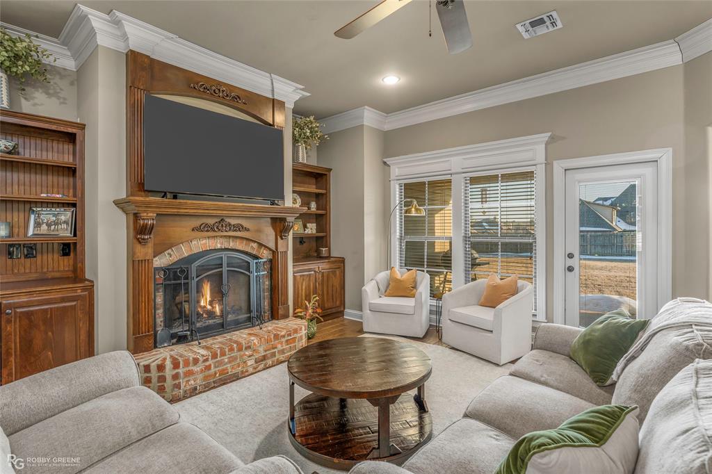 3034 Sagefield Lane Haughton, LA 71037 - Photo 4 of 28 a living room with furniture large window and a fireplace