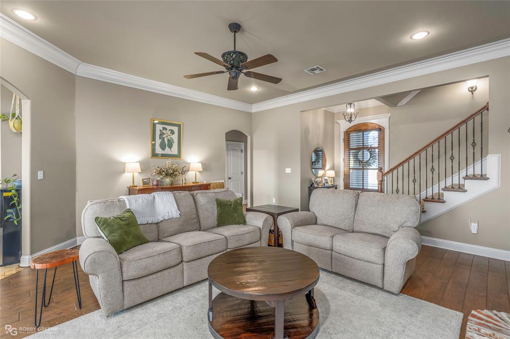 3034 Sagefield Lane Haughton, LA 71037 - Photo 6 of 28 a living room with furniture and a chandelier