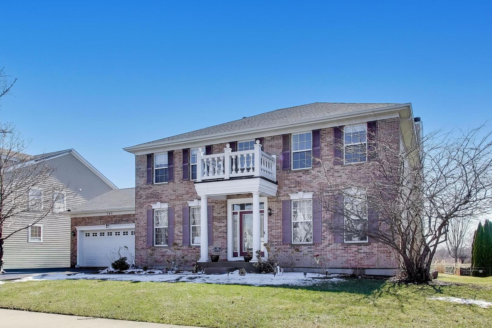 343 Copper Springs Lane Elgin, IL 60124 - Photo 1 of 50 a front view of a house with a yard