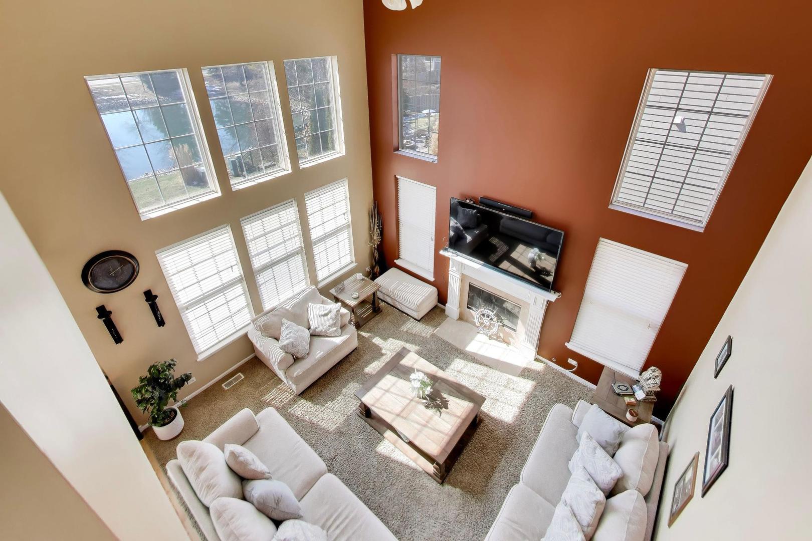 343 Copper Springs Lane Elgin, IL 60124 - Photo 12 of 50 a view of living room with furniture and a flat screen tv