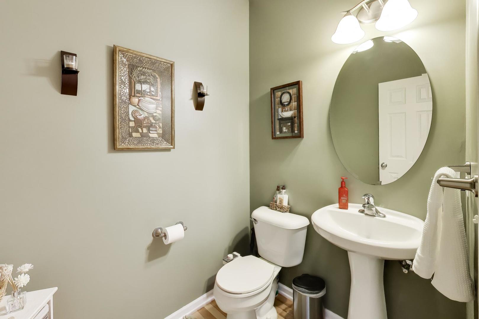 343 Copper Springs Lane Elgin, IL 60124 - Photo 17 of 50 a bathroom with a toilet sink and mirror