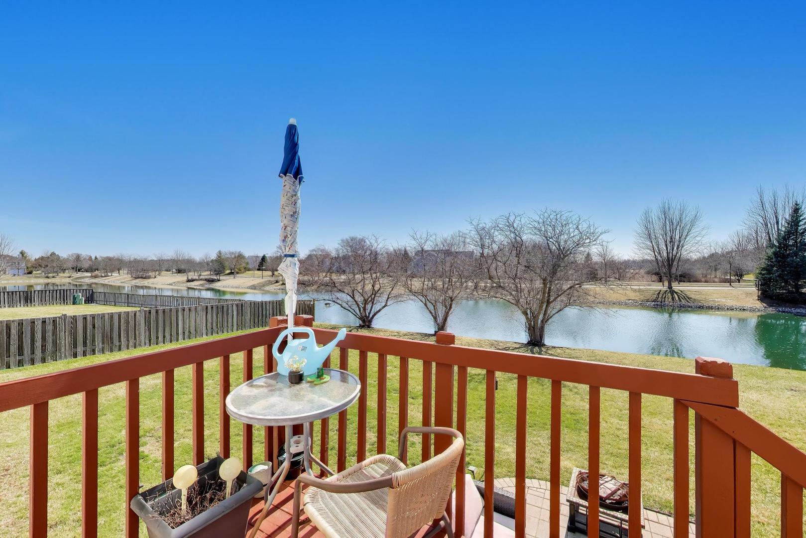 343 Copper Springs Lane Elgin, IL 60124 - Photo 3 of 50 a view of a balcony with lake view and wooden floor