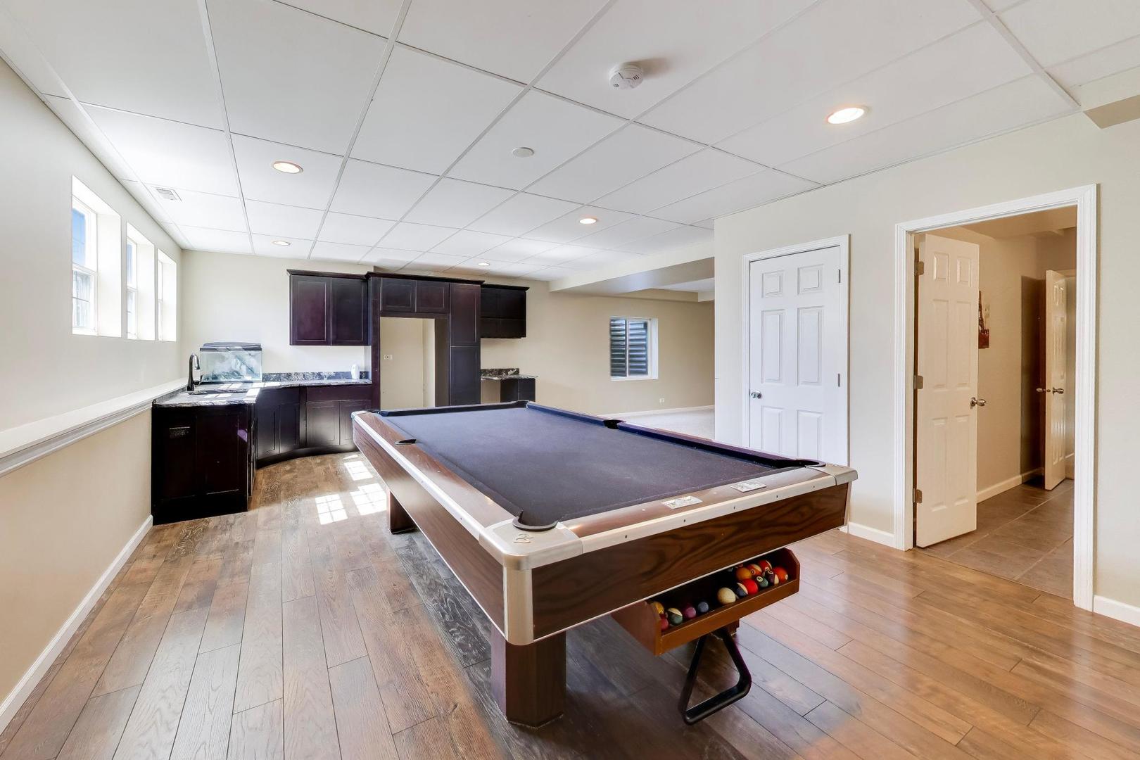 343 Copper Springs Lane Elgin, IL 60124 - Photo 35 of 50 a room with pool table and window