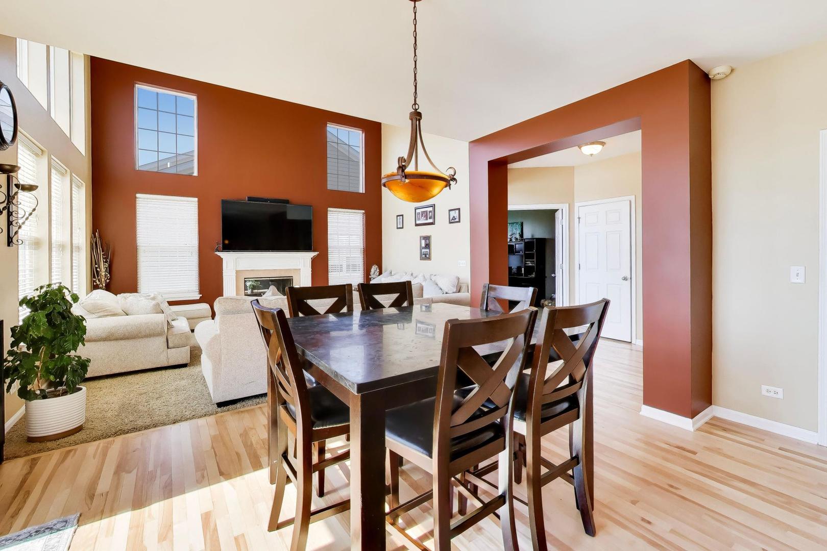 343 Copper Springs Lane Elgin, IL 60124 - Photo 9 of 50 a view of a dining room with furniture window and wooden floor